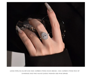Close-up of a 5.6ct oval pink high-carbon diamond ring in S925 silver on a model hand