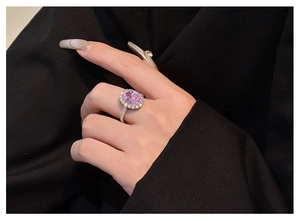 Detail of 5.6 carat oval pink high carbon diamond ring with halo setting on S925 silver