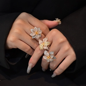 Three-color floral S925 silver rings with layered petals and sparkling cubic zirconia pavé