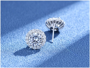 Detailed macro view of S925 silver stud earrings featuring round cut sparkling stones