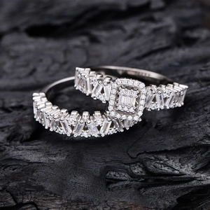 Sparkling S925 silver double ring set with baguette diamonds on charcoal background