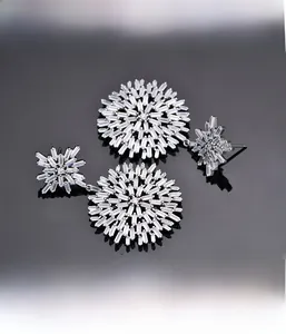Macro shot showing precision baguette-cut stones in snowflake earring craftsmanship