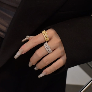 Sparkling crown rings in gold and silver finish with pavé set zircon stones on finger