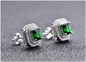 Macro shot of square emerald earrings in S925 silver with double-layered pavé zircons