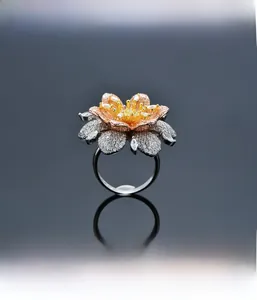 Detailed macro view of tri-color sunflower ring with micro-paved zircon petals