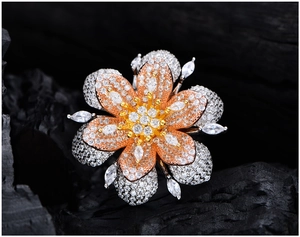 Detailed close-up of multi-layer flower ring with micro-pave zircon on dark texture
