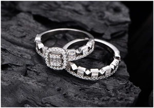 Macro shot of S925 sterling silver hourglass halo ring set with baguette cut diamonds