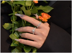 Close-up of S925 sterling silver ring set with halo square diamond and pave band