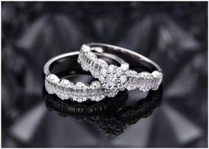Macro shot of S925 sterling silver scalloped wedding ring set with micro-pave diamonds