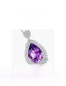 Close-up of pear-shaped purple gemstone pendant with halo setting in 925 silver