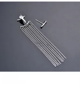 Close-up of S925 sterling silver asymmetric tassel earrings with shiny metal chains