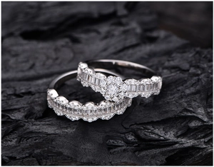 Macro shot of S925 sterling silver ring set with zircon pavé on a textured black background