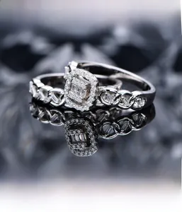Macro shot of silver stackable ring set with square cluster diamonds and twisted band