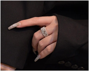 Detailed close-up of S925 sterling silver wide band ring with rectangle pave cubic zirconia