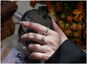 Macro view of S925 silver rings with pavé cubic zirconia worn in a real-life setting