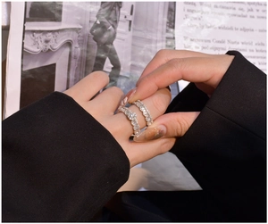 Detail of S925 silver ring set with baguette cut diamonds and minimalist metal bands