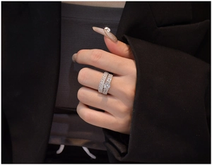 Detail of 925 silver wedding set with 6mm main stone worn by model in formal suit