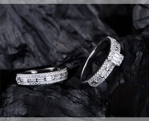 Detail of S925 silver ring featuring baguette-cut and pave-set cubic zirconia on charcoal