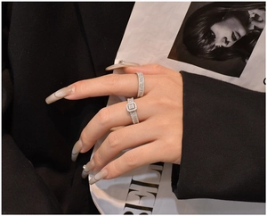 Macro detail of S925 sterling silver ring set with square zircon and eternity band