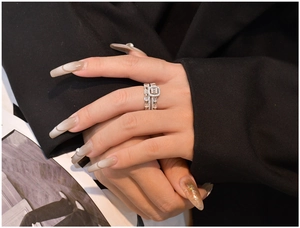 Close-up of S925 sterling silver hourglass stacked ring set with micro-pave zircons