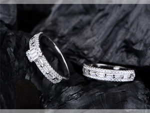 Macro detail of S925 silver ring set featuring baguette-cut and pavé diamonds