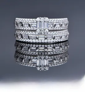 Macro detail of silver S925 sterling silver stacked rings with baguette cut zircon