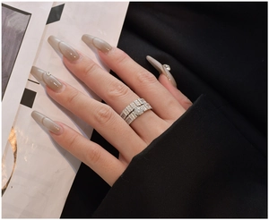 Detailed close-up of a luxury S925 silver stacked ring set with micro-pave zirconia crystals