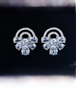 Macro shot of S925 silver flower stud earring with micro-pave cubic zirconia crystals
