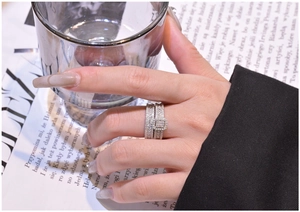 Detailed close-up of a three-piece S925 silver stacked ring set with emerald-cut stones