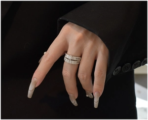 Macro detail of S925 silver snowflake double ring set with shimmering cubic zirconia