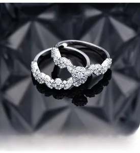 Macro shot of S925 silver rings with pavé micro-inlaid zircons and platinum plating