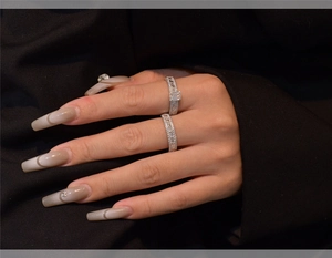 Detail of S925 silver ring set with micro-paved rectangular cubic zirconia on a model