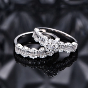 S925 sterling silver snowflake ring set with wavy band on black reflective surface