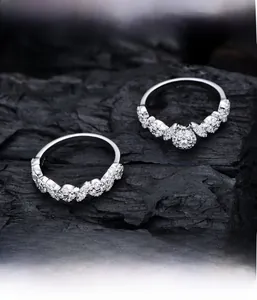 Macro shot of S925 sterling silver rings with micro-pave cubic zirconia on charcoal