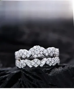 Macro shot of 925 silver ring set with 5A cubic zirconia stones on a dark texture