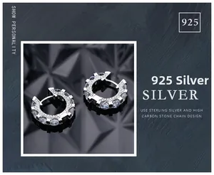 Macro shot of 925 sterling silver hoop earrings with pave-set shimmering carbon diamonds
