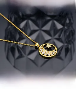 Macro detail of microscopic micro-inlay technology on gold moon and star pendant
