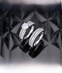 Detailed macro view of S925 silver wedding ring set with micro-pave marquise diamonds