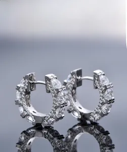 Macro shot of S925 sterling silver hoop earrings with pave-set 5A cubic zirconia stones
