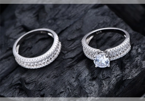 Macro shot of S925 sterling silver ring set showing 925 hallmark and sparkling stones