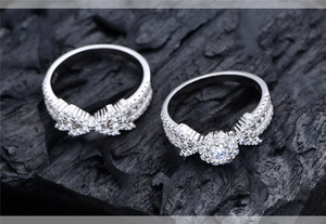 Macro shot of S925 sterling silver rings with snowflake and arrow zircon pavé setting
