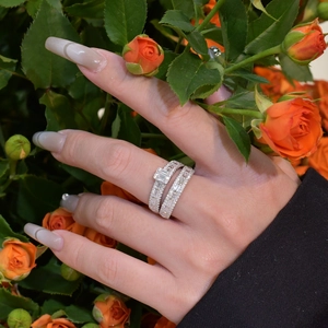 Elegant S925 sterling silver stacked ring set with emerald cut zircons on a floral background