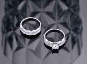 Macro shot of silver stacking ring set with round cubic zirconia and pavé stones