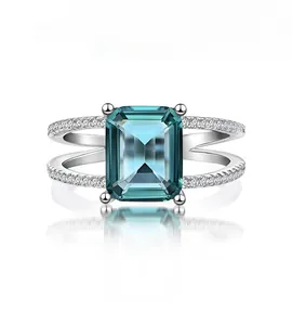 Detailed front view of emerald-cut dark green zircon ring in S925 silver with white accents