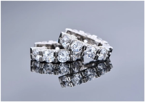 Close-up of S925 sterling silver hoop earrings with double row of pavé set crystals