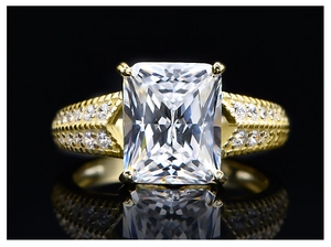 Macro shot of 5.6ct radiant cut yellow gemstone ring in gold plated S925 silver