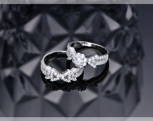 Macro detail of S925 sterling silver rings with micro-set zircon and arrow snowflake design