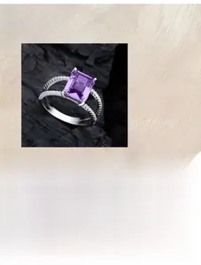 Macro detail of 925 silver ring with rectangle purple crystal and pave zircon setting