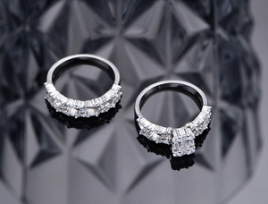 Detail of S925 silver double ring set with clear cubic zirconia stones on mirror base