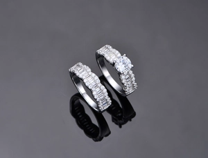 Macro shot of wave texture S925 silver ring set with zircon pave and brilliant center stone
